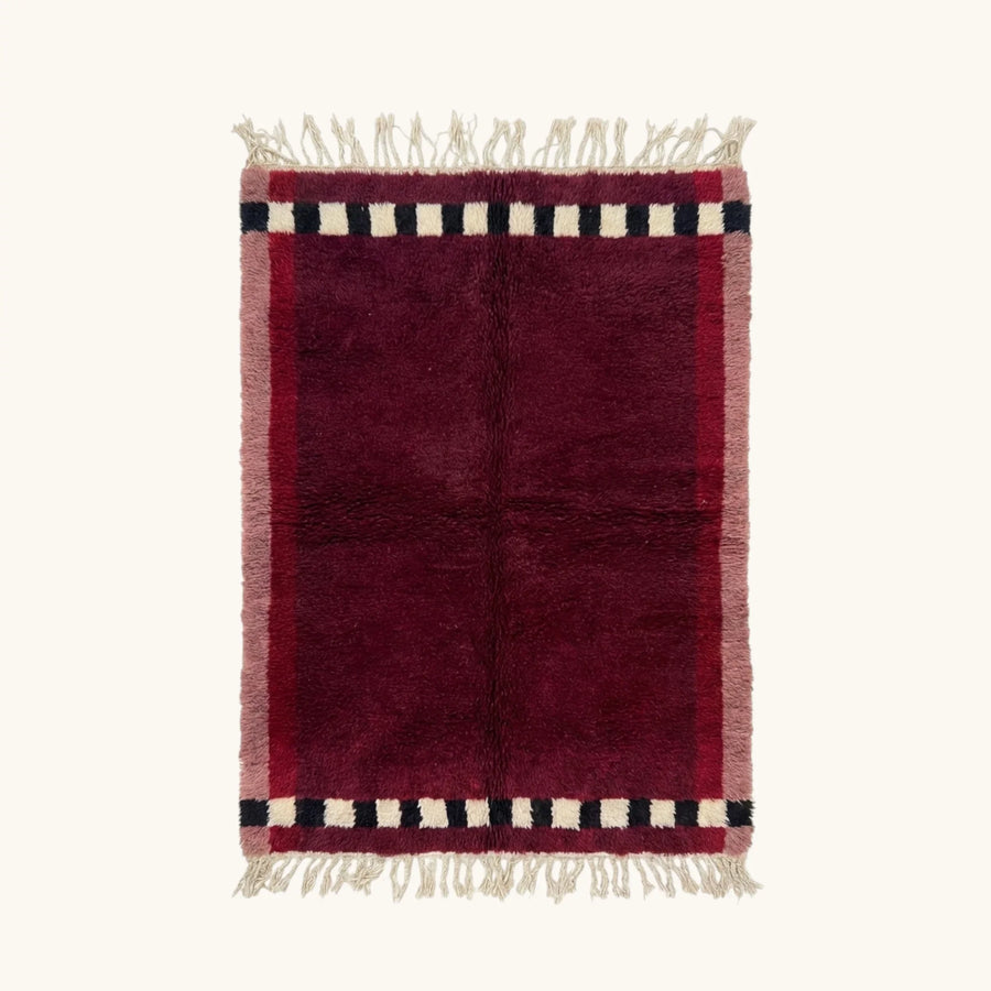 Itran burgundy Beni Ourain rug with checkered border motif, full view