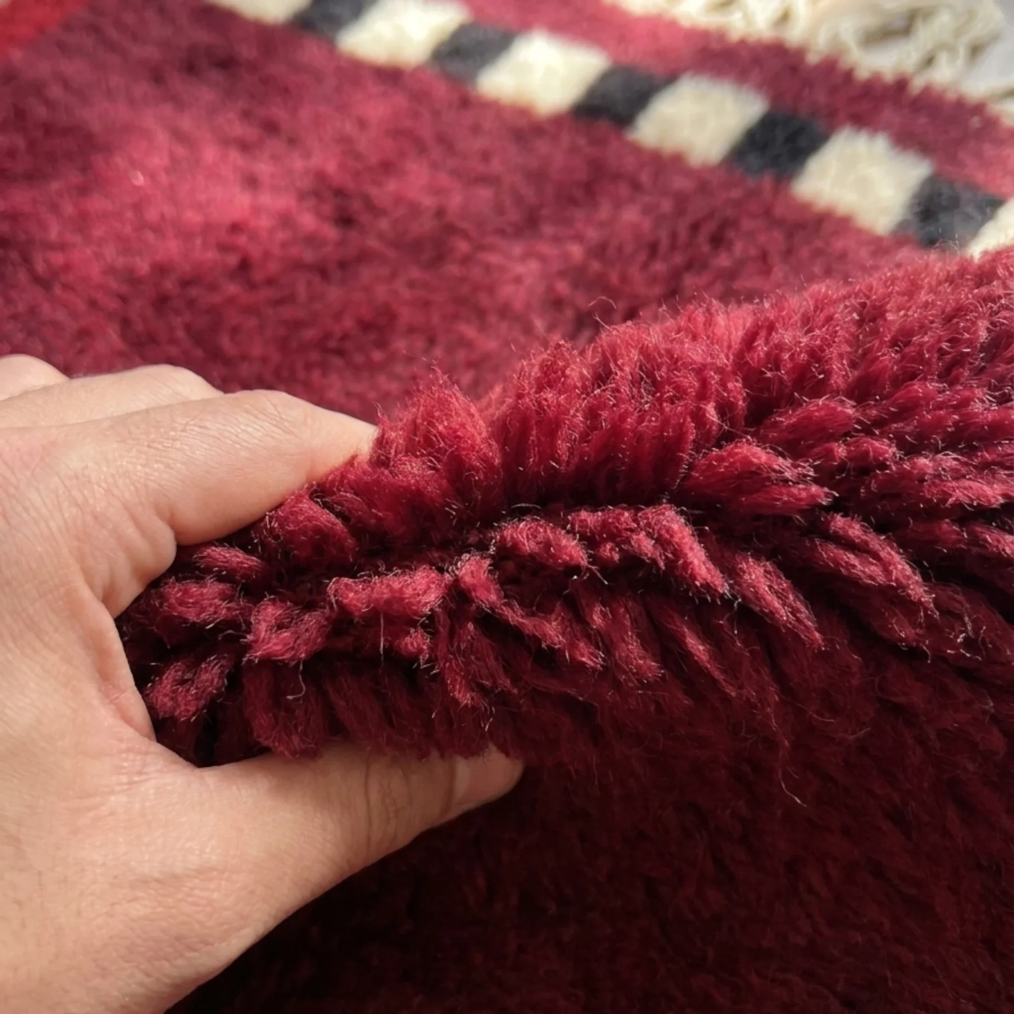 Itran burgundy Beni Ourain rug wool softness detail