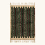 Full view of the Itri green Beni Ourain rug with organic stripes and hand-tied fringe.