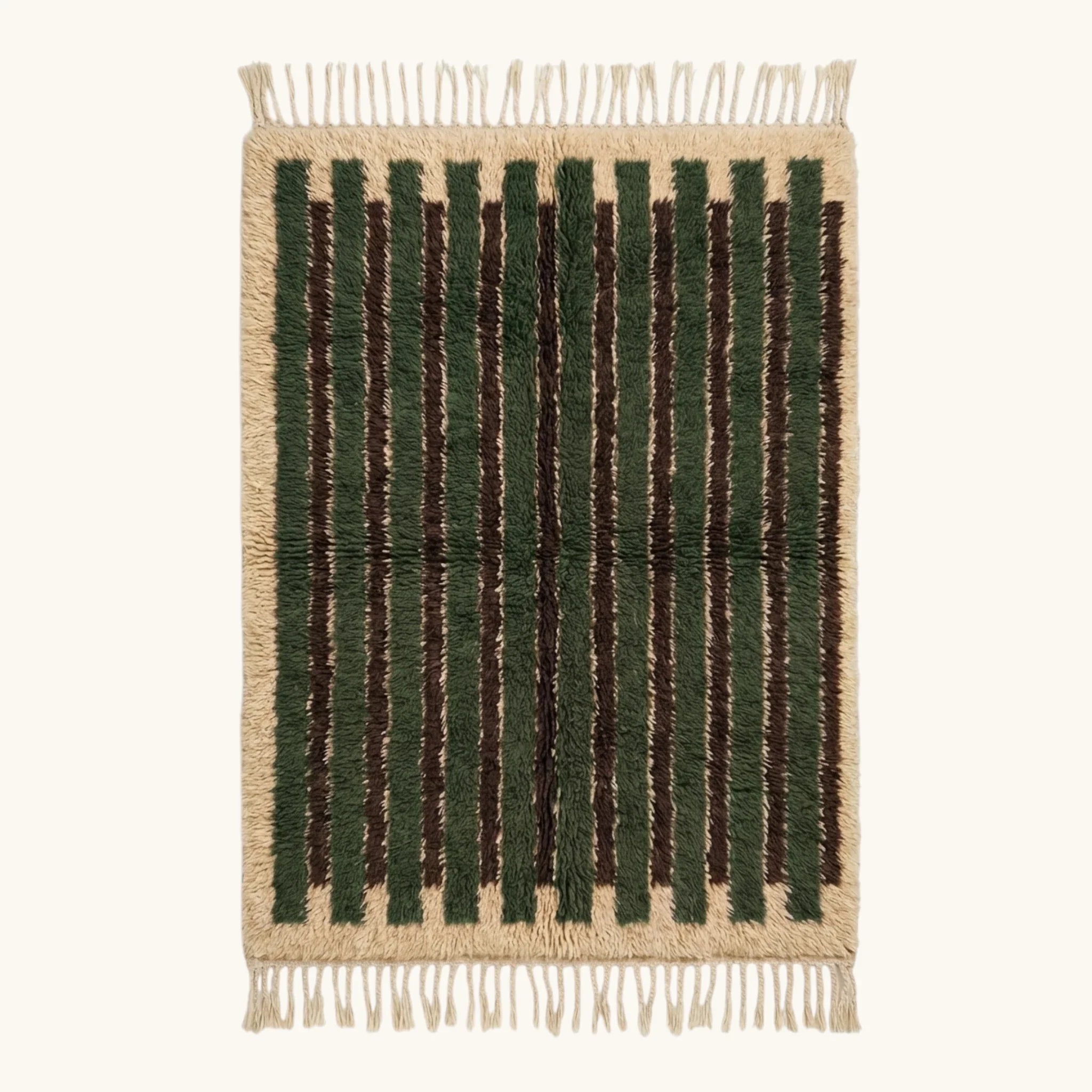 Full view of the Itri green Beni Ourain rug with organic stripes and hand-tied fringe.