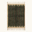 Full view of the Itri green Beni Ourain rug with organic stripes and hand-tied fringe.