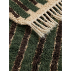 Close-up of the green and ivory striped pattern on the Itri Moroccan rug.