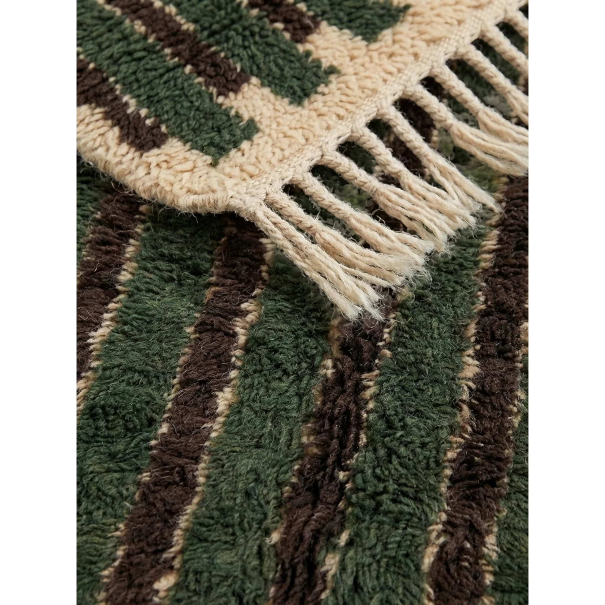 Close-up of the green and ivory striped pattern on the Itri Moroccan rug.
