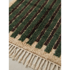 Natural wool texture detail of the Itri green Beni Ourain rug.