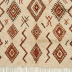 Ivory Azilal rug Adrar with rust diamond pattern, wool texture detail