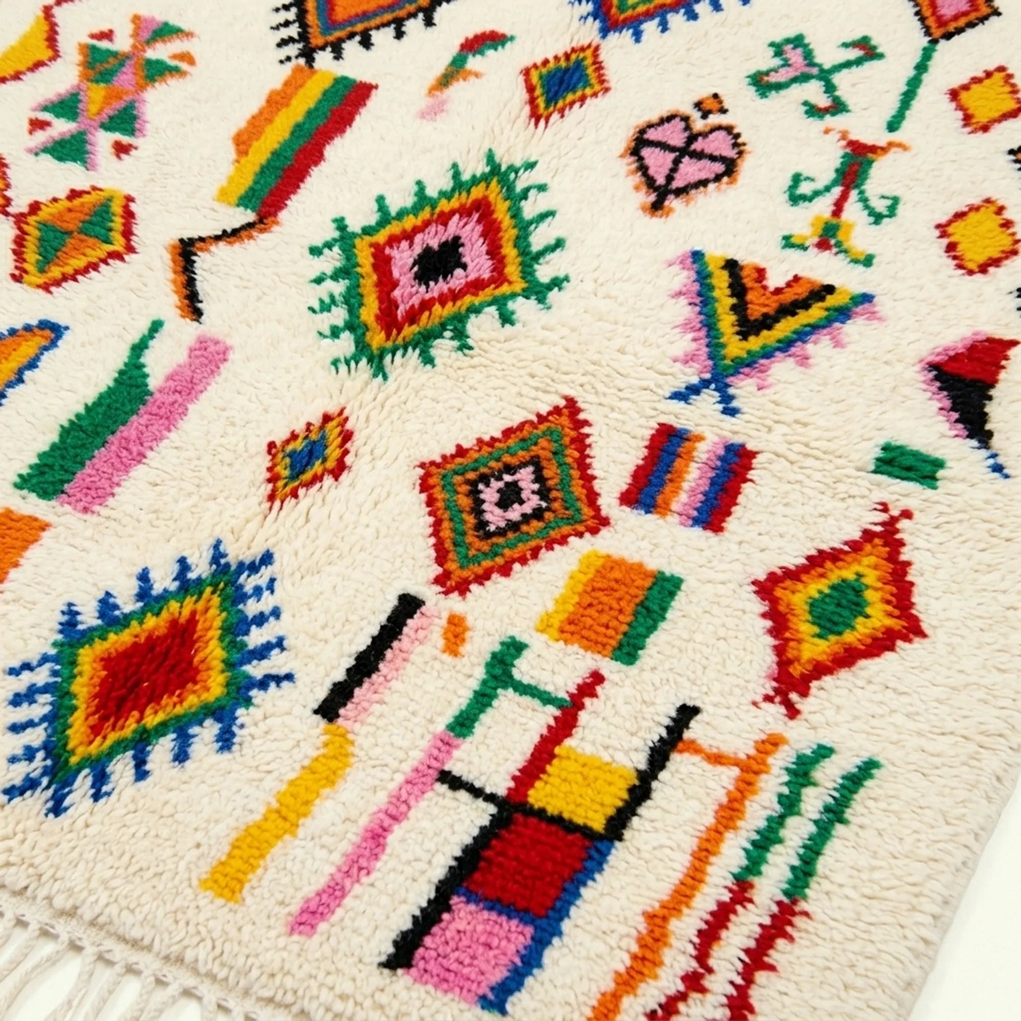 Ivory Azilal rug Afella with vivid multicolor symbols, fringe detail