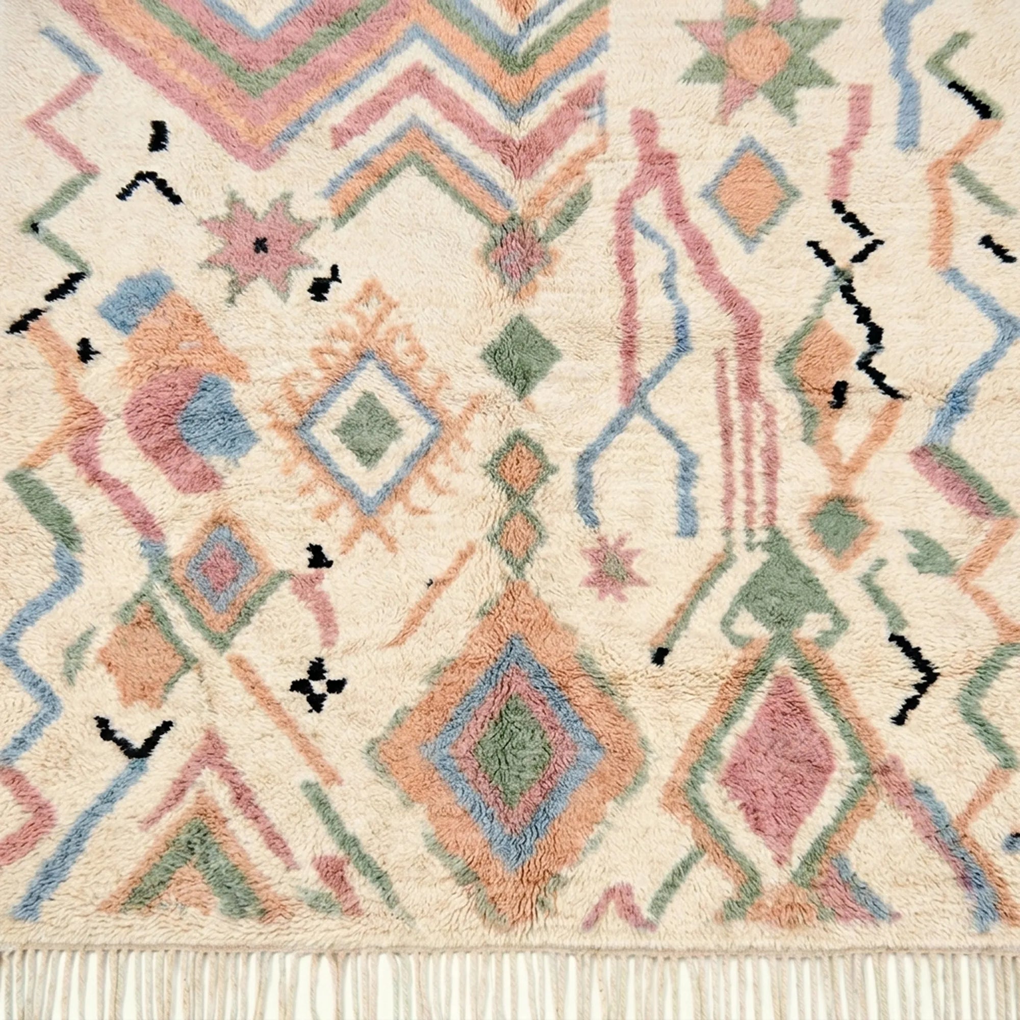 Ivory Azilal rug Amarg with pastel zigzag symbols, wool texture detail