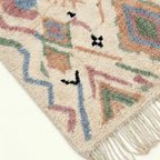 Ivory Azilal rug Amarg with pastel zigzag symbols, fringe detail