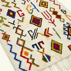 Ivory Azilal rug Amayas with abstract symbol pattern, wool texture detail