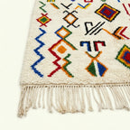 Ivory Azilal rug Amayas with abstract symbol pattern, fringe detail