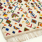 Ivory Azilal rug Amezri with multicolor symbol mosaic, border detail
