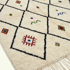 Ivory Azilal rug Asafu with black grid symbols, pattern detail