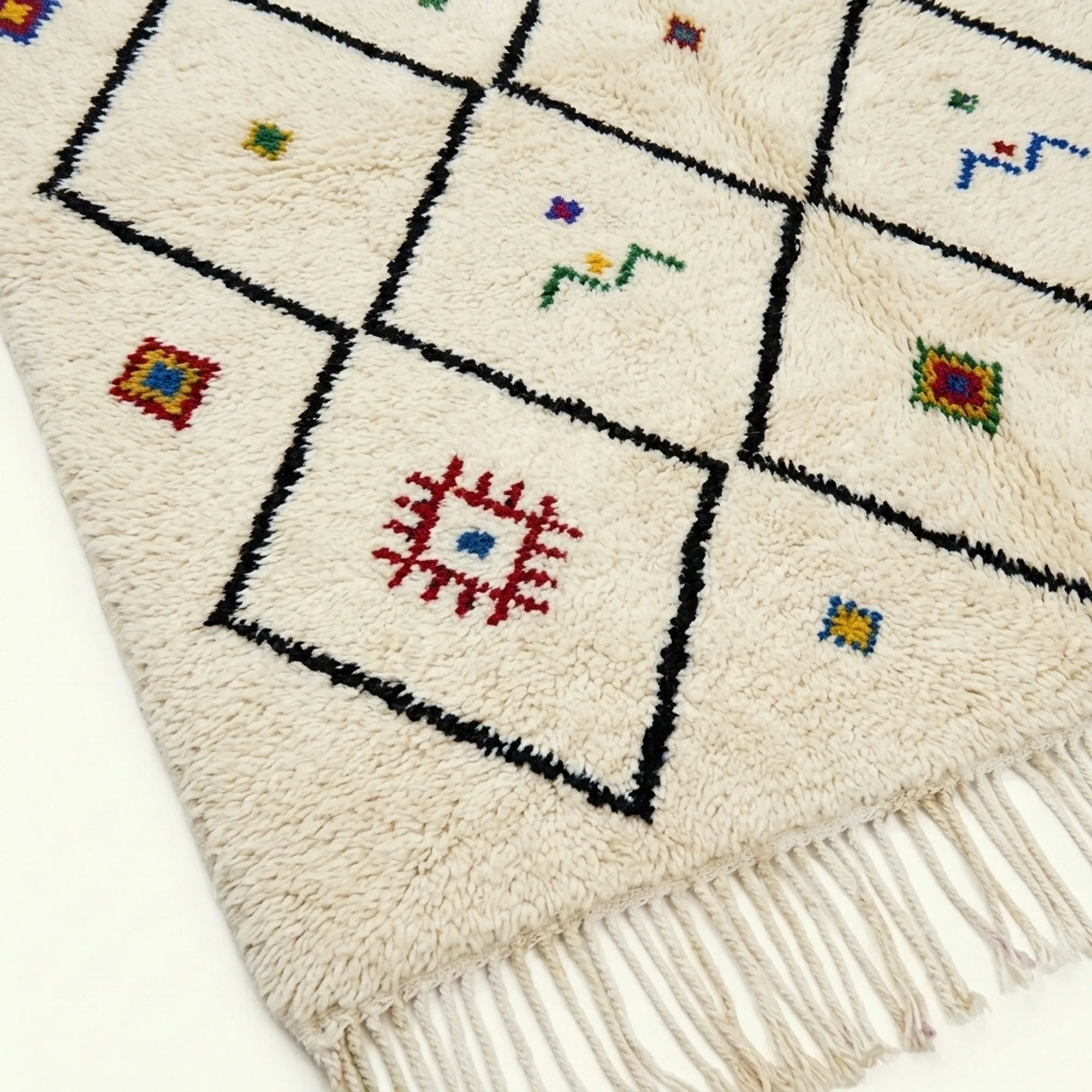 Ivory Azilal rug Asafu with black grid symbols, wool texture detail