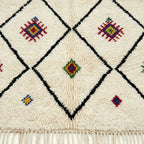 Ivory Azilal rug Asafu with black grid symbols, border detail