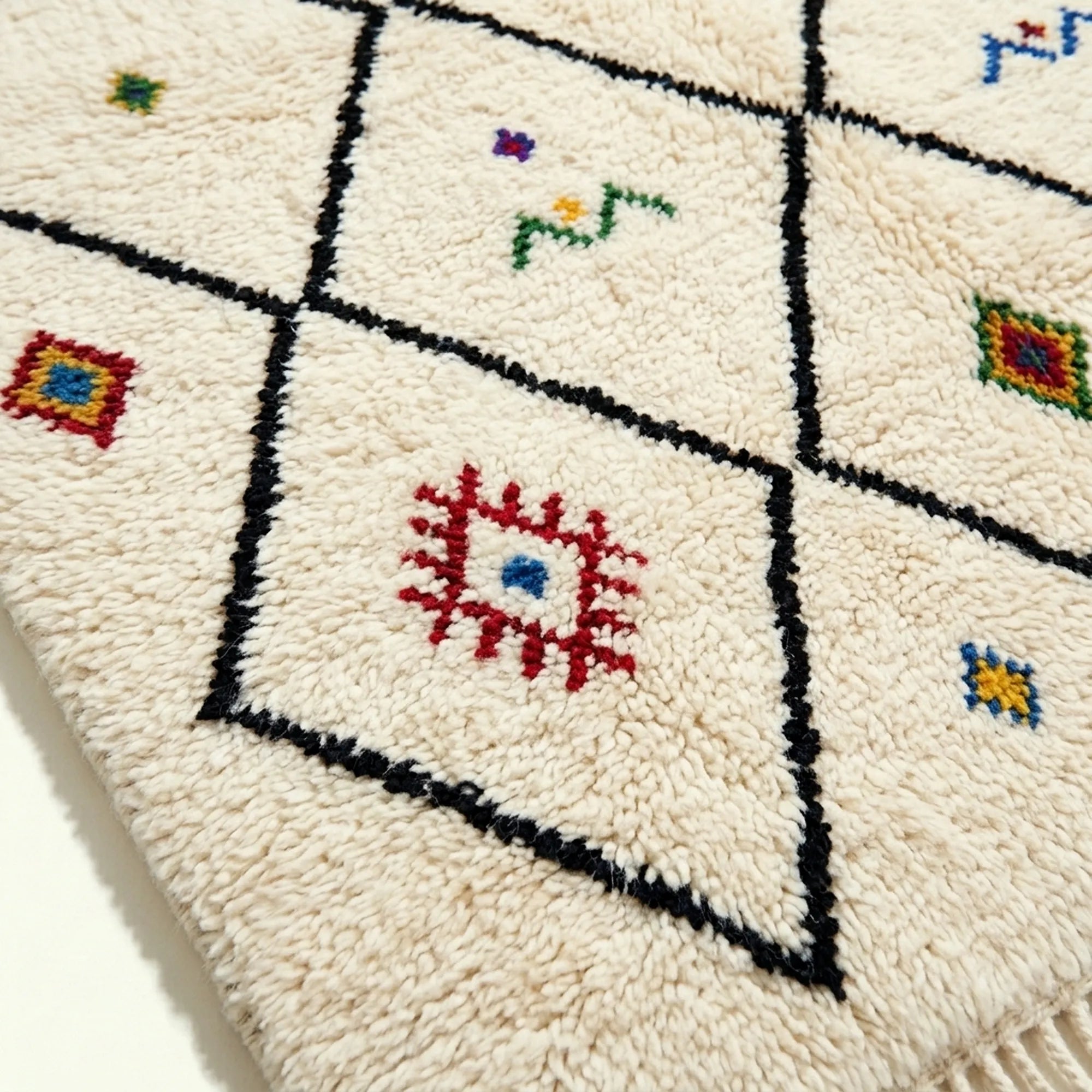 Ivory Azilal rug Asafu with black grid symbols, fringe detail