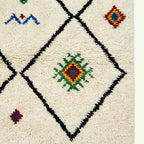 Ivory Azilal rug Asafu with black grid symbols, craftsmanship detail