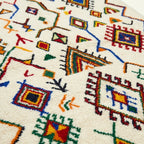 Ivory Azilal rug Asefru with tribal diamond pattern, wool texture detail