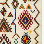 Ivory Azilal rug Asefru with tribal diamond pattern, fringe detail