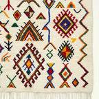 Ivory Azilal rug Asefru with tribal diamond pattern, craftsmanship detail