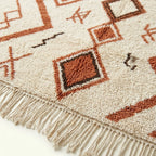 Ivory Azilal rug Assif with rust zigzag diamonds, border detail
