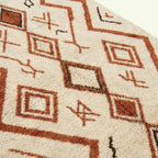Ivory Azilal rug Assif with rust zigzag diamonds, fringe detail