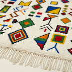 Ivory Azilal rug Azwaw with multicolor symbol pattern, wool texture detail