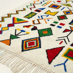 Ivory Azilal rug Azwaw with multicolor symbol pattern, border detail