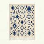Ivory Azilal rug Imnayen with blue tribal diamonds, full rug view
