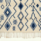 Ivory Azilal rug Imnayen with blue tribal diamonds, fringe detail