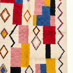 Natural wool texture detail of the ivory multicolor Izem Azilal rug