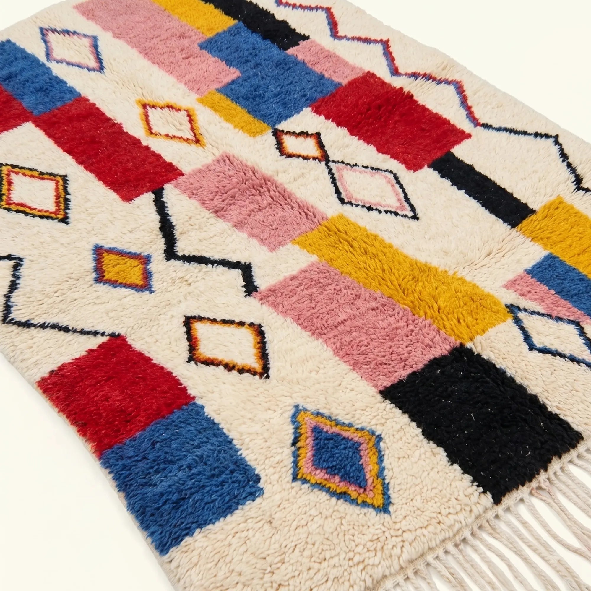 Border and motif detail of the ivory multicolor Izem Azilal rug