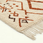 Ivory Azilal rug Izri with rust linear diamond pattern, wool texture detail