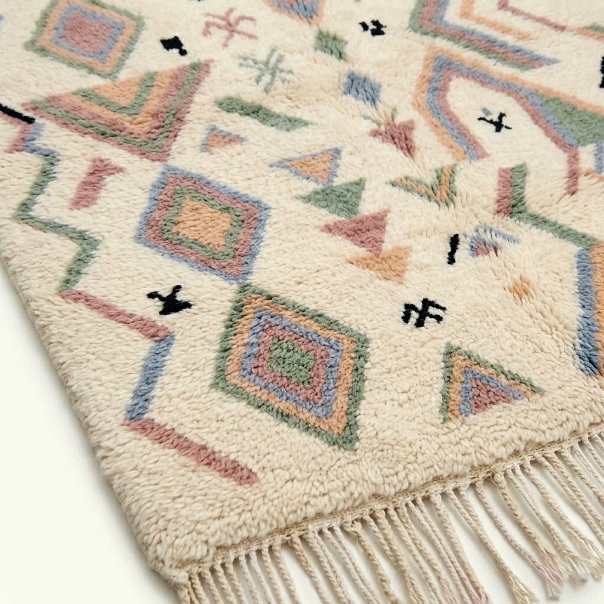 Ivory Azilal rug Tamazla with pastel tribal pattern, wool texture detail