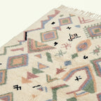 Ivory Azilal rug Tamazla with pastel tribal pattern, border detail