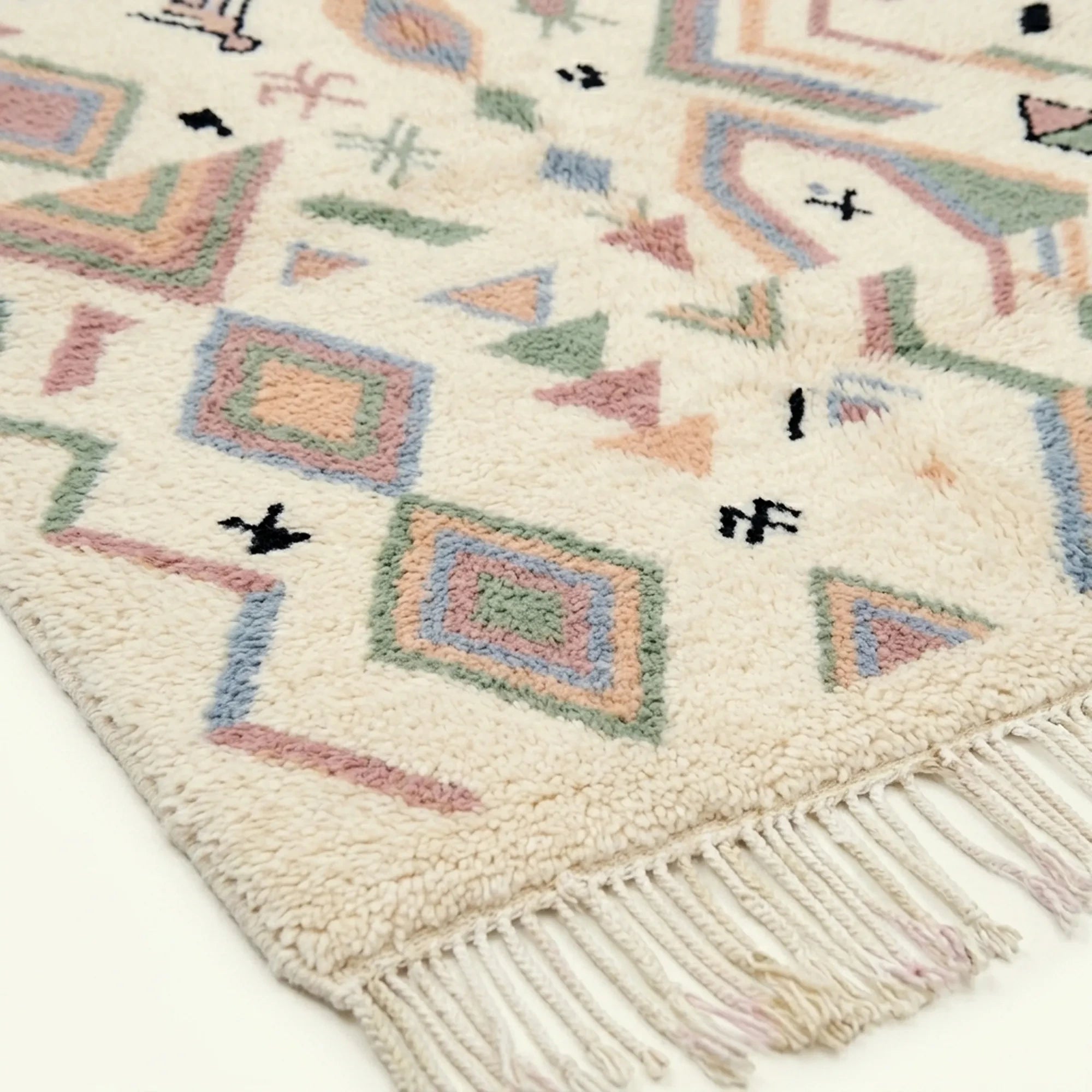 Ivory Azilal rug Tamazla with pastel tribal pattern, fringe detail