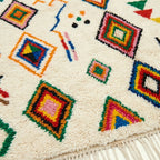 Ivory Azilal rug Tamuda with multicolor diamond mosaic, fringe detail