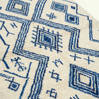 Ivory Azilal rug Tasga with blue angular diamonds, border detail