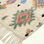 Ivory Azilal rug Tiwizi with pastel diamond columns, wool texture detail
