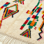 Ivory Azilal rug Tuda with multicolor stripe diamonds, border detail