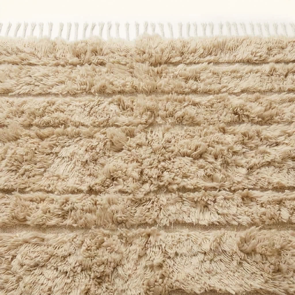 Ivory Beni Ourain rug corner detail showing knotted fringe and weave construction