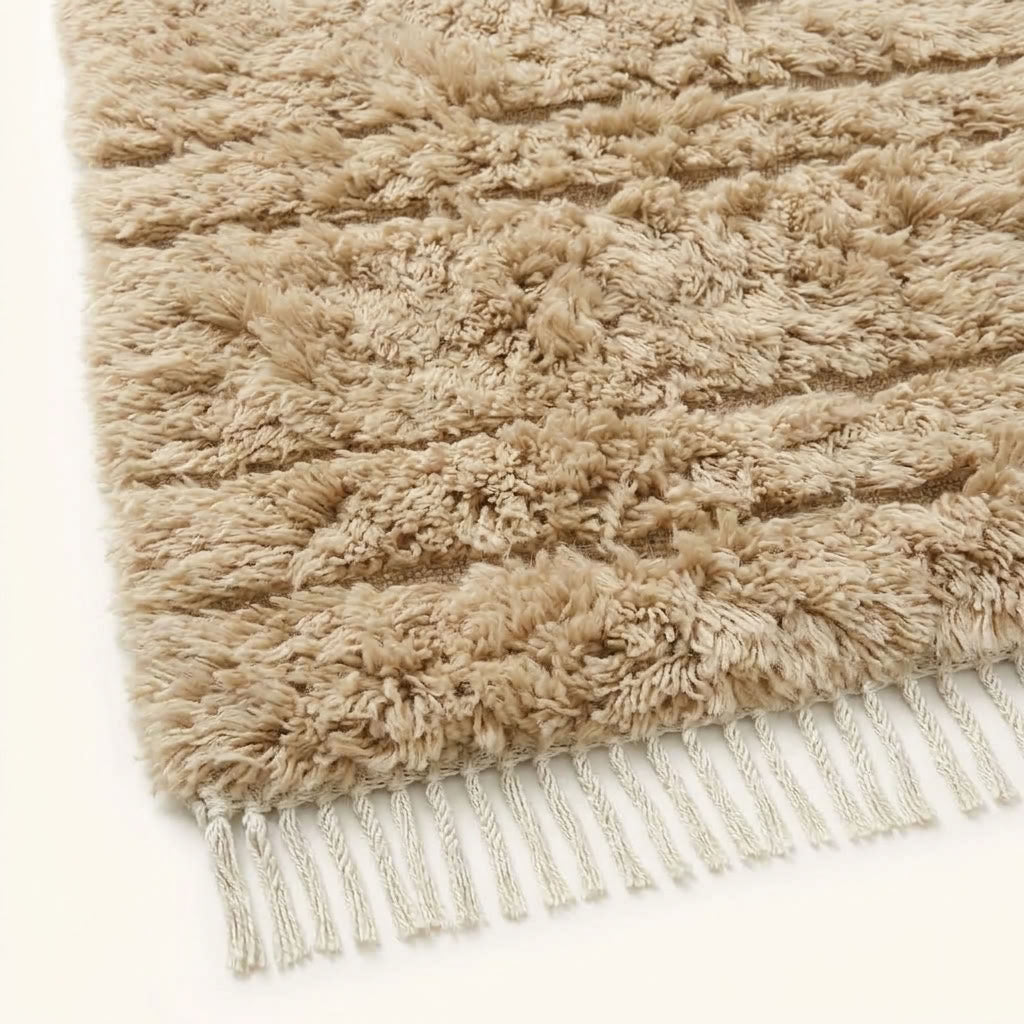 Angled close-up of ivory wool pile showing depth and soft texture of Beni Ourain construction