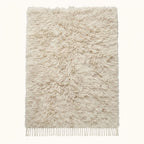 Ivory Beni Ourain rug with soft undyed pile on plain background, full flat view