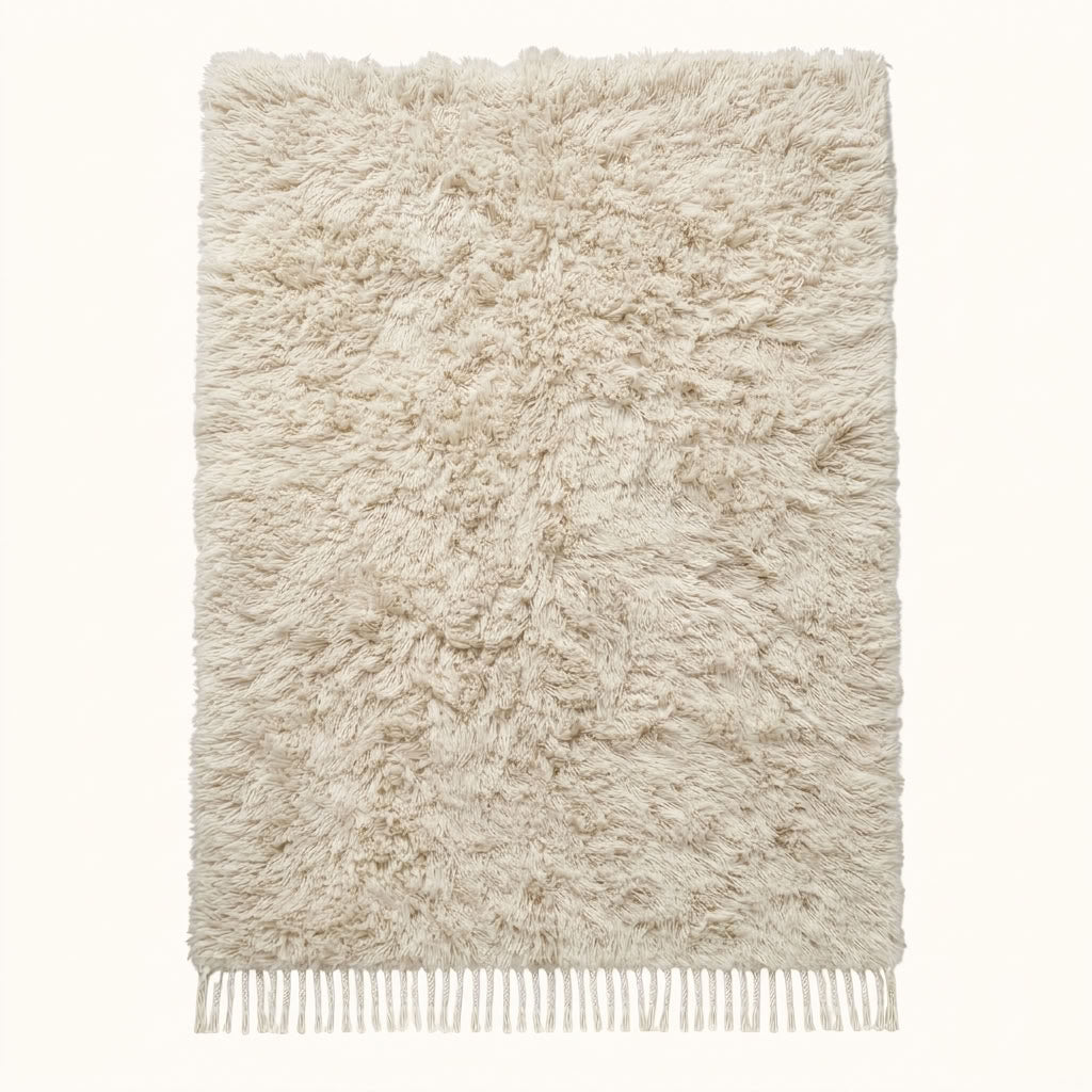 Ivory Beni Ourain rug with soft undyed pile on plain background, full flat view