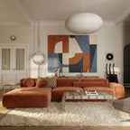 Ivory Beni Ourain rug in living room with rust sofa and modern artwork