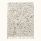 Ivory Beni Ourain Rug – Textured Pile – Kella, flat lay on neutral background showing thick wool pile and fringe