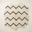 Ivory and black Beni Ourain rug with horizontal chevron stripe design, full view on plain background