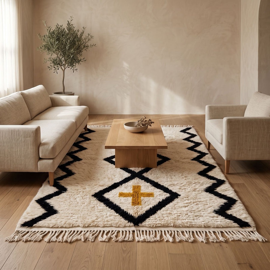 Ivory, black and gold Beni Ourain rug in modern living room with cream sofa and wooden coffee table