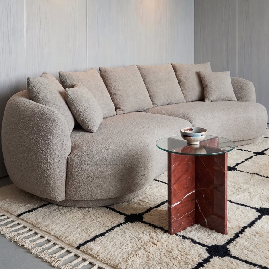 Ivory and black grid Beni Ourain rug in modern living room with curved sofa