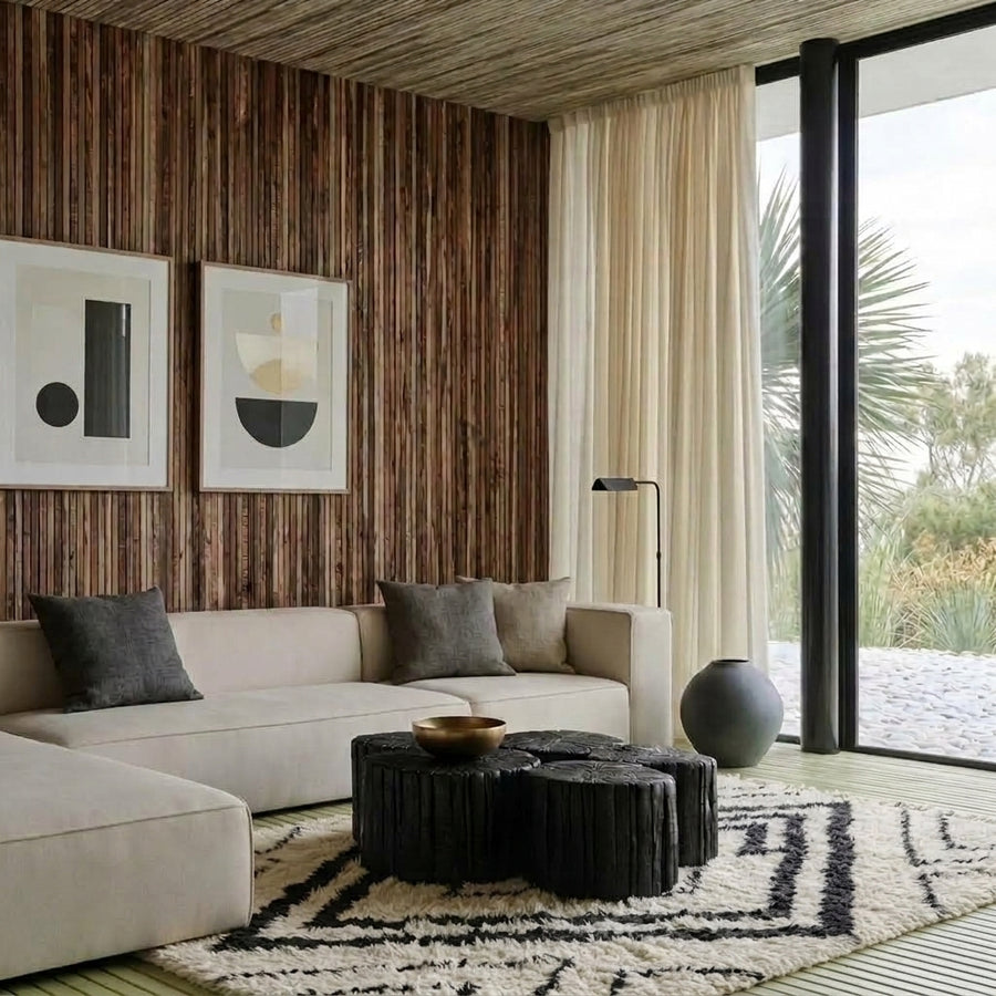 Ivory and black nested diamond Beni Ourain rug in modern living room with cream sofa and wood-panelled walls