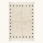 Full view of the ivory and black square border Beni Ourain rug.